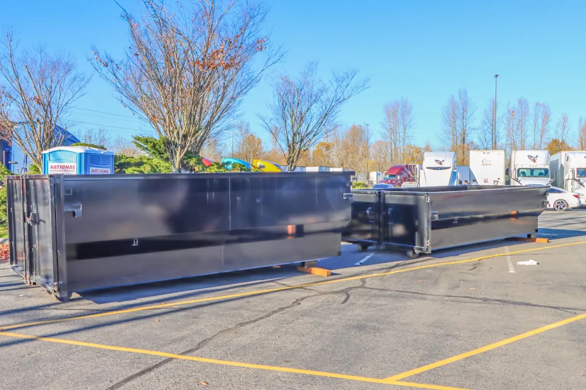 Professional dumpster rental service with roll-off container on residential driveway in Allen Park